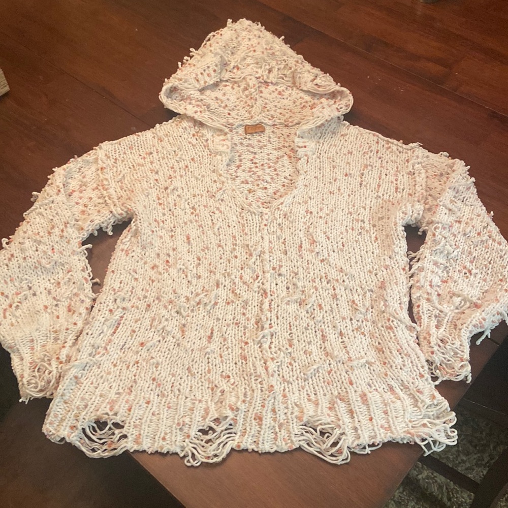 Offwhite distressed oversized sweater with hood.